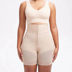 Woman wearing high waist tummy control shapewear shorts in beige