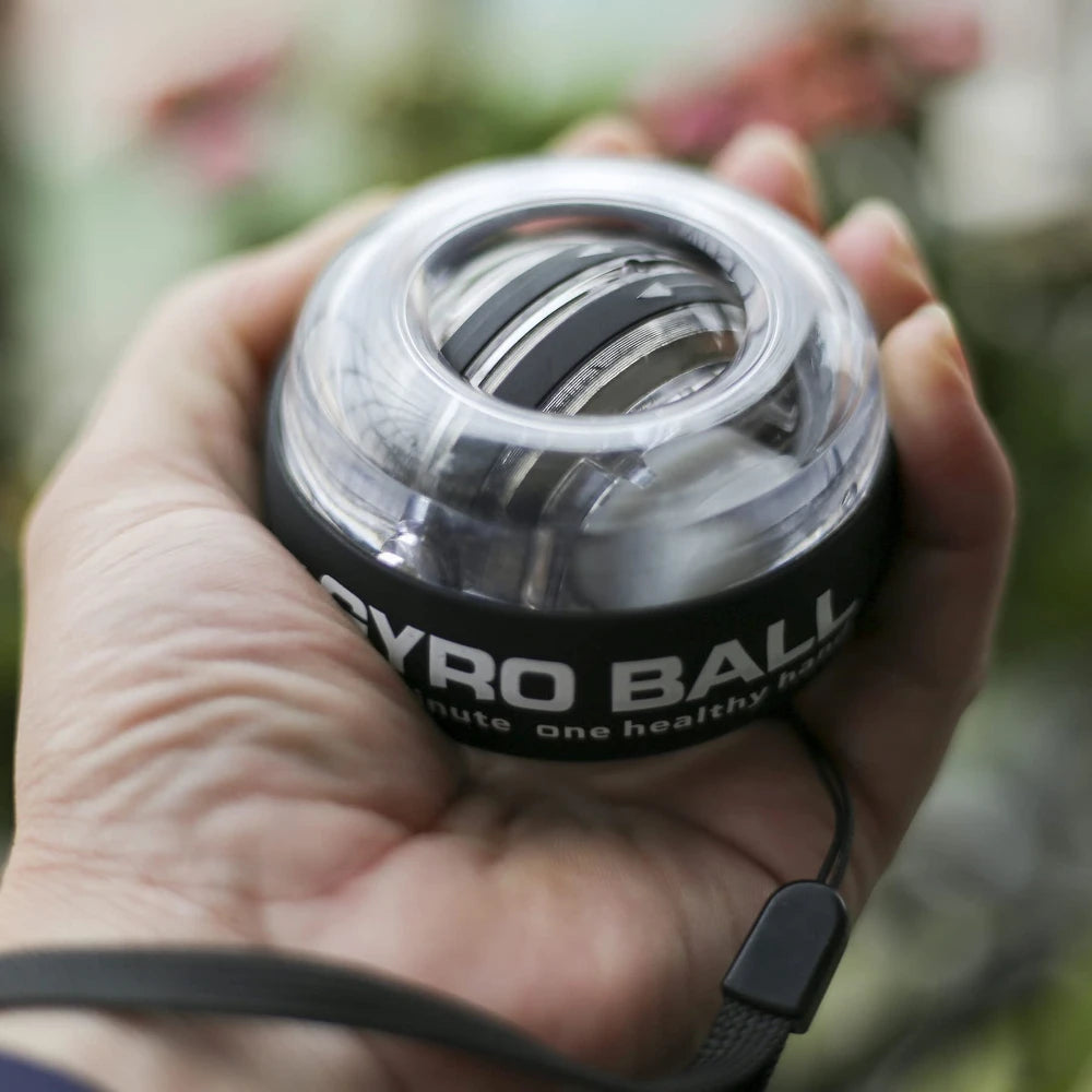LED wrist ball trainer held in hand for grip exercise