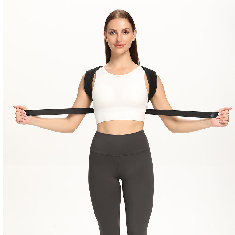 Woman in a white top stretching the posture corrector belt strap behind her back to show its elasticity